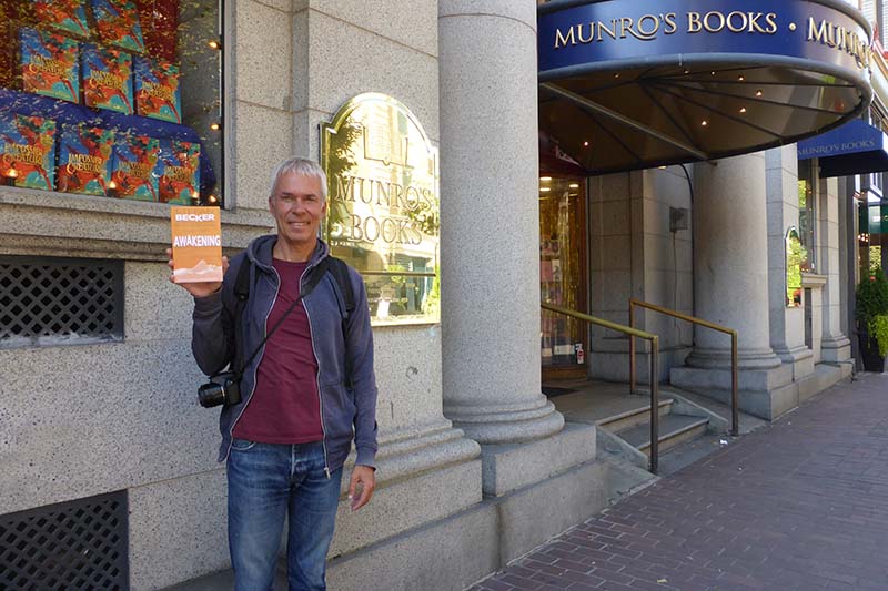 Stefan Becker in Victoria Canada with AWAKENING outside Munro's Books.